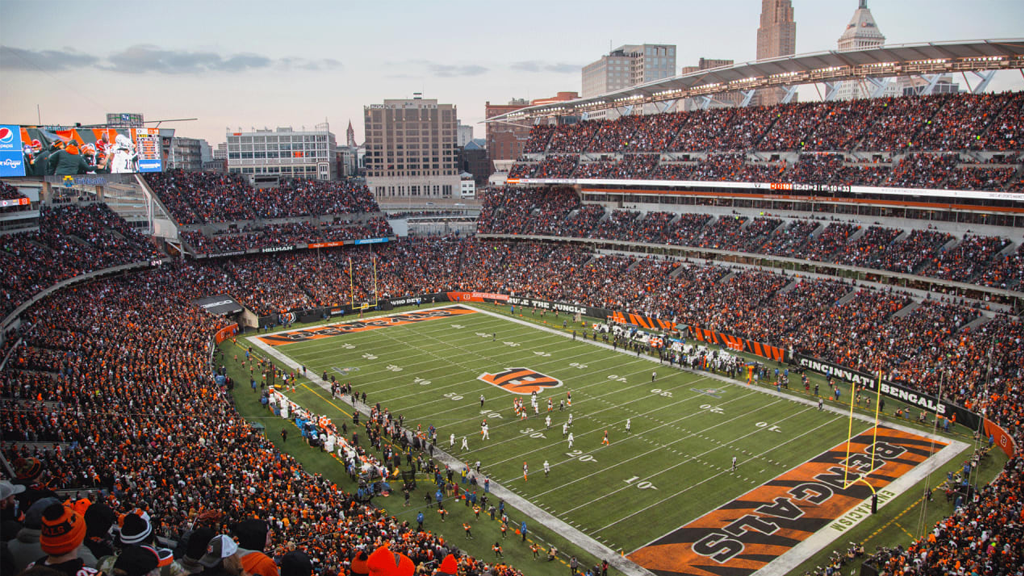 Packed NFL stadium at dusk